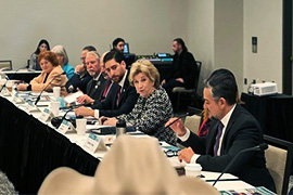 Secretary Nelson sitting at a table with leaders. 