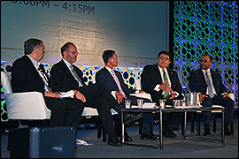 Secretary Pablos sitting with a panel at the 2017 BIO International Conference.