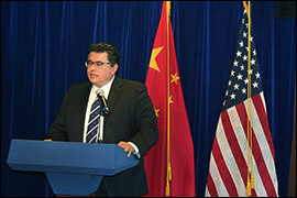 Secretary Pablos standing behind a podium.