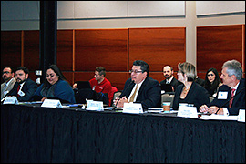 Secretary Pablos sitting at a long table with committee members