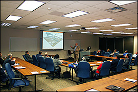 Speaker is presenting to a classroom.