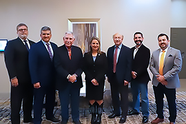 Group of smiling people standing together.